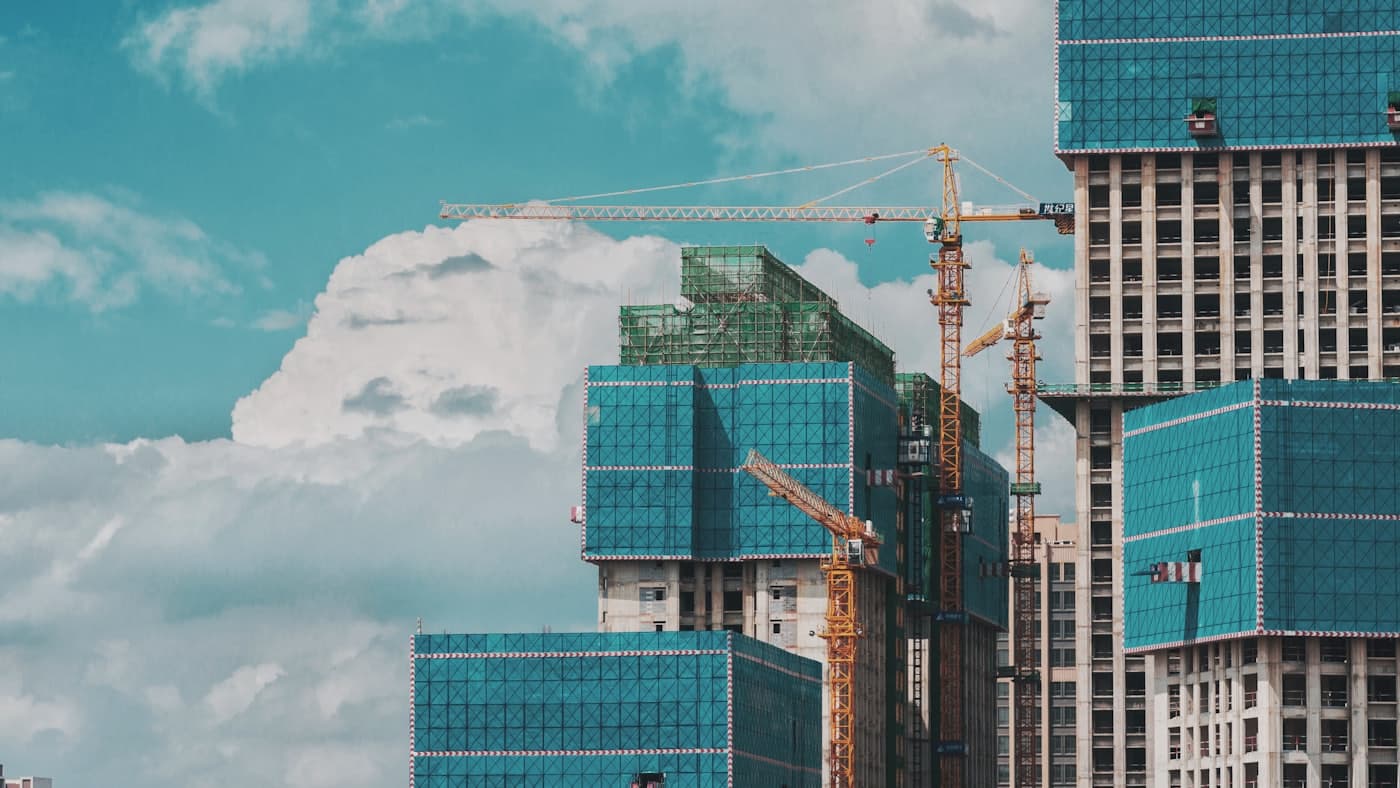 High-rise towers under construction with a tower crane
